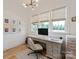 Bright home office with custom built-ins, a large desk and natural light at 11008 Strike The Gold Ln, Waxhaw, NC 28173