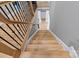 Staircase with wood treads, black metal balusters, and a light-filled landing at 11008 Strike The Gold Ln, Waxhaw, NC 28173