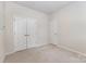 Empty bedroom with carpet, neutral paint and white trim at 11226 Dappled Light Trl, Charlotte, NC 28227