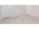 Clean, carpeted bedroom featuring neutral walls and multiple access doors for convenience at 11226 Dappled Light Trl, Charlotte, NC 28227