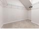Walk-in closet with wire shelving, carpet flooring, and ample storage space at 11226 Dappled Light Trl, Charlotte, NC 28227