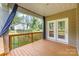 Inviting wooden deck featuring an outdoor view, classic wood railings, and access to a lush backyard at 11226 Dappled Light Trl, Charlotte, NC 28227