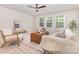 Cozy living room featuring ample natural light, modern furniture, and a stylish area rug at 11226 Dappled Light Trl, Charlotte, NC 28227