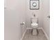 Clean and simple powder room with a white toilet, neutral walls, and tiled flooring at 11226 Dappled Light Trl, Charlotte, NC 28227