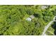 Aerial view showing the location of the pool and the surrounding forest at 114 Larkfield Dr, Waxhaw, NC 28173
