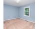 Bedroom with light blue walls and neutral carpet at 114 Larkfield Dr, Waxhaw, NC 28173