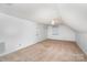 A carpeted bedroom with ample space, a window for natural light, and neutral walls at 114 Larkfield Dr, Waxhaw, NC 28173