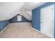 A carpeted bedroom features a door, window, and painted accent wall at 114 Larkfield Dr, Waxhaw, NC 28173
