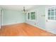 Bright dining room with hardwood floors, a light fixture, and a large window at 114 Larkfield Dr, Waxhaw, NC 28173