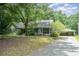 Charming single-story home featuring a screened porch and a detached two-car garage at 114 Larkfield Dr, Waxhaw, NC 28173