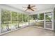 Screened porch with an outdoor ceiling fan at 114 Larkfield Dr, Waxhaw, NC 28173
