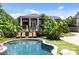 Beautiful home with a pool and spa with tropical landscaping at 117 N Central Ave, Belmont, NC 28012