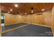 Home gym or flex space featuring rubber floors, a full wall mirror, and wood-paneled walls at 117 N Central Ave, Belmont, NC 28012