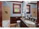 Charming bathroom with granite countertop, wooden accents, and soaking tub at 117 N Central Ave, Belmont, NC 28012