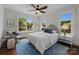 Cozy bedroom with natural light, soft blue accents, and hardwood floors at 117 N Central Ave, Belmont, NC 28012