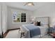 Cozy bedroom featuring wood floors, bright natural light, and neutral decor at 117 N Central Ave, Belmont, NC 28012