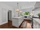 Well-lit kitchen featuring a large island and stainless steel appliances at 117 N Central Ave, Belmont, NC 28012
