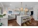 Modern kitchen with marble countertops, kitchen island and seating at 117 N Central Ave, Belmont, NC 28012