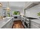 Bright kitchen with island, white subway tile, and stainless steel appliances at 117 N Central Ave, Belmont, NC 28012