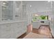 Bright kitchen with floor to ceiling cabinets and glass display cabinets at 117 N Central Ave, Belmont, NC 28012