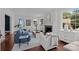 Inviting living room with a fireplace, ample natural light, and elegant furnishings at 117 N Central Ave, Belmont, NC 28012