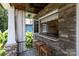 Covered patio with an outdoor bar featuring a pass-through window to the kitchen at 117 N Central Ave, Belmont, NC 28012