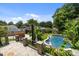Backyard view of the pool and meticulously manicured yard at 117 N Central Ave, Belmont, NC 28012