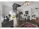 Bright room with large windows, spiral staircase, neutral colors, and stylish decor at 117 N Central Ave, Belmont, NC 28012