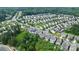Aerial view showcases a lush, green neighborhood with manicured lawns and tree-lined streets at 1314 San Gabriel Ave, Charlotte, NC 28214