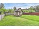 Landscaped backyard with a playhouse at 1314 San Gabriel Ave, Charlotte, NC 28214