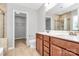 Bathroom featuring double vanity, walk-in shower, and linen closet at 1314 San Gabriel Ave, Charlotte, NC 28214