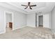 Spacious bedroom with large windows, ceiling fan and attached bathroom at 1314 San Gabriel Ave, Charlotte, NC 28214