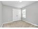 Bedroom featuring neutral paint, carpet, a window with blinds, and closet at 1314 San Gabriel Ave, Charlotte, NC 28214