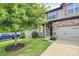 Charming two-story home with stone accents, a two-car garage, and a well-manicured lawn at 1314 San Gabriel Ave, Charlotte, NC 28214