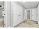 Hallway with closet and doorways, showcasing neutral paint and carpet at 1314 San Gabriel Ave, Charlotte, NC 28214