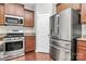Kitchen featuring stainless steel appliances, granite countertops and wooden cabinets at 1314 San Gabriel Ave, Charlotte, NC 28214