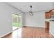 Well-designed living area featuring hardwood floors, a sliding glass door, and built-in appliances, ideal for modern living at 1314 San Gabriel Ave, Charlotte, NC 28214