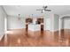 Expansive living area with hardwood floors, pendant lights, and stainless steel appliances, blending style and functionality at 1314 San Gabriel Ave, Charlotte, NC 28214