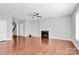 Spacious living room featuring hardwood floors, a classic fireplace, and an open layout perfect for entertaining at 1314 San Gabriel Ave, Charlotte, NC 28214
