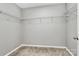 Spacious walk-in closet features ample wire shelving for easy organization at 1314 San Gabriel Ave, Charlotte, NC 28214