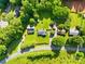 Aerial view of property highlighting the expansive lot size, surrounded by lush greenery and mature trees at 13715 Mayes Rd, Huntersville, NC 28078