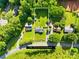 Aerial view of property highlighting the expansive 0.53 acre lot size, surrounded by lush greenery and mature trees at 13715 Mayes Rd, Huntersville, NC 28078