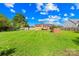 Expansive, lush backyard featuring a well-maintained lawn and fenced perimeter, offering ample space for outdoor activities at 13715 Mayes Rd, Huntersville, NC 28078
