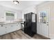 Eat-in kitchen boasts white cabinets, granite countertops and stainless steel appliances at 13715 Mayes Rd, Huntersville, NC 28078