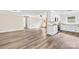 Open-concept living space featuring hardwood floors and a kitchen with granite countertops at 13715 Mayes Rd, Huntersville, NC 28078