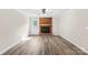 Living room features hardwood floors and brick fireplace at 13715 Mayes Rd, Huntersville, NC 28078