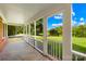View from screened porch looking out to a green lawn and trees at 13715 Mayes Rd, Huntersville, NC 28078