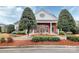 Community clubhouse building with brick facade, white siding and manicured landscaping at 14451 San Paolo Ln, Charlotte, NC 28277