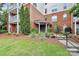 Well-maintained building entrance with lush landscaping and accessible ramp at 14451 San Paolo Ln, Charlotte, NC 28277