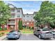 Beautiful condo complex with brick facade, manicured landscaping, and ample parking at 14451 San Paolo Ln, Charlotte, NC 28277